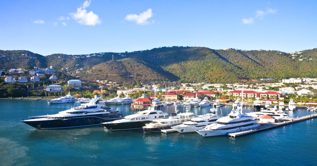 Large Super Yachts moored in a marina in the Caribbean