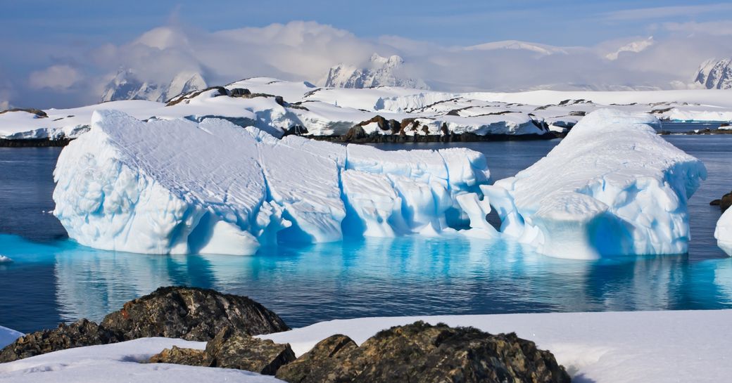snow-covered landscapes of Antarctica with icy blue waters