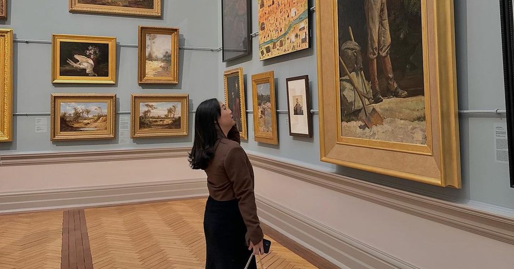 woman looking at the art in south wales art gallery, syndey, australia