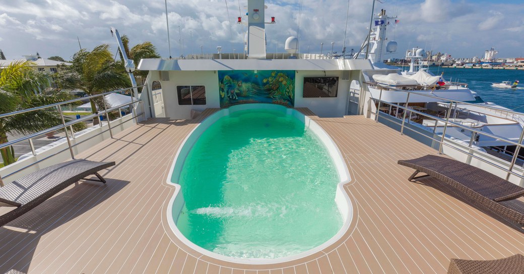 swimming pool on the sundeck of luxury yacht GLOBAL 