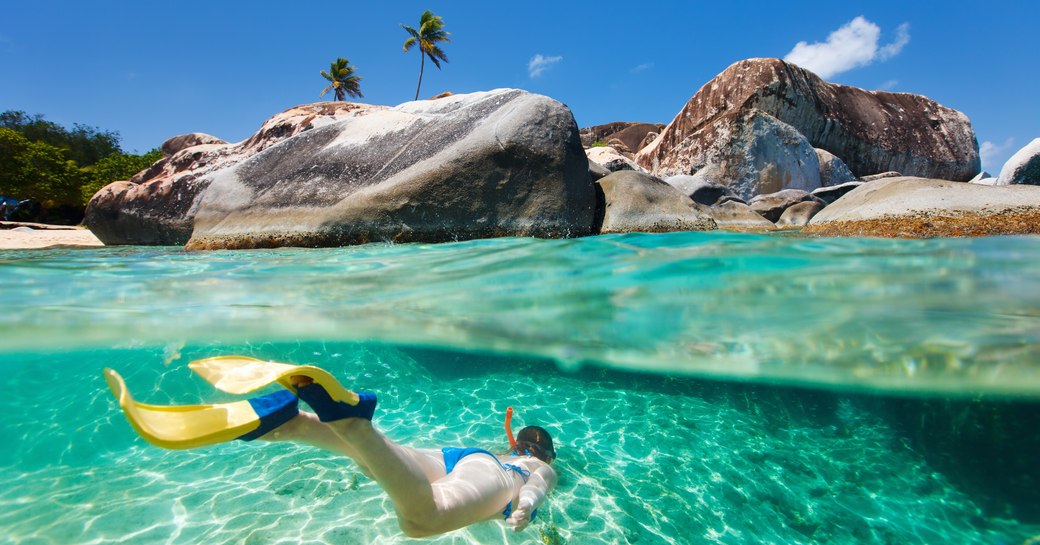 A snorkeler at The Baths on Virgin Gorda in the BVIs, Caribbean