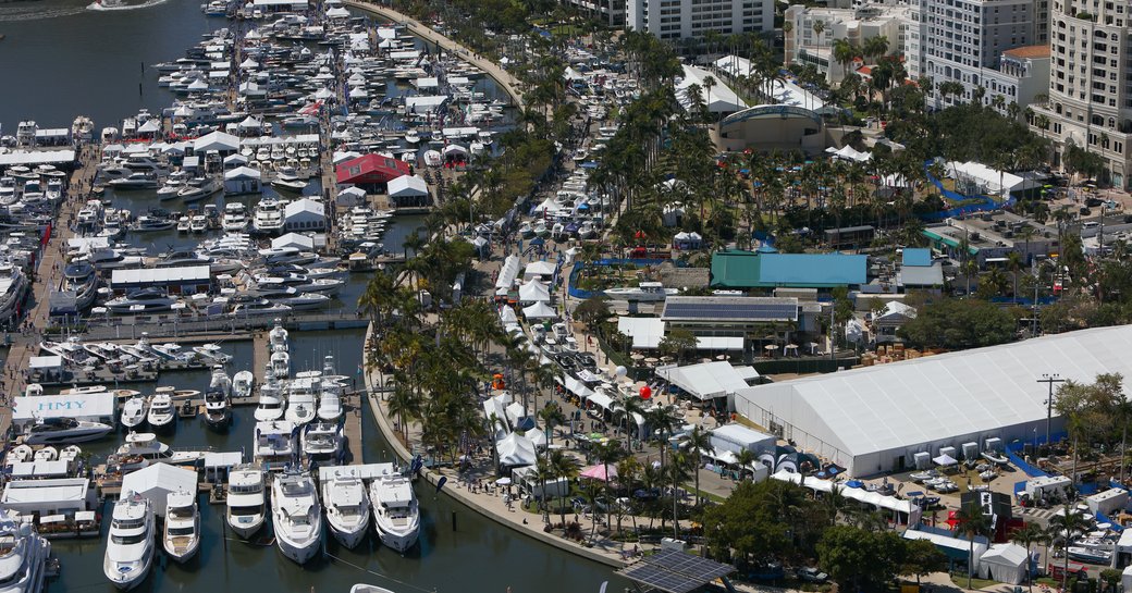 Aerial view looking down on the Palm Beach International Boat Show and Flagler Drive, many motor yacht charters berthed in the marina