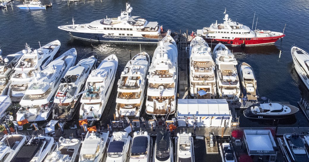 Aerial view looking down on motor yachts berthed at FLIBS