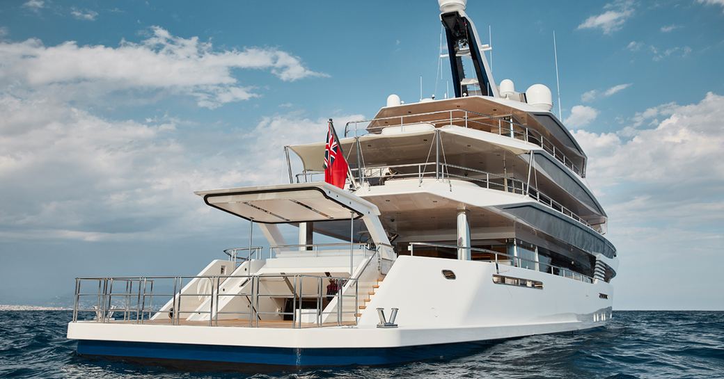 aft view of motor yacht JOY with her lift-up transom which opens into the beach club