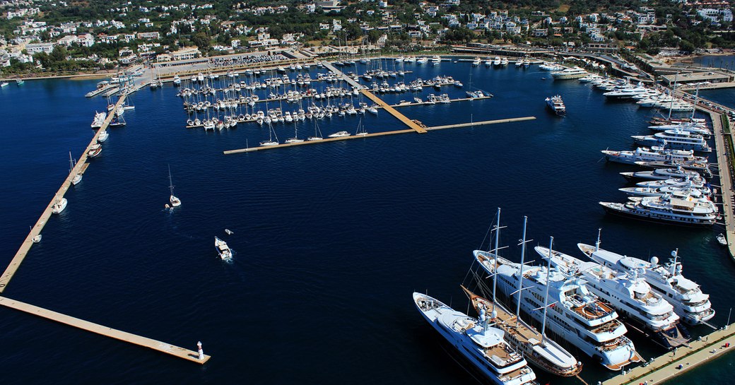 aerial shot of luxury yachts lined up in Yalikavak Marina