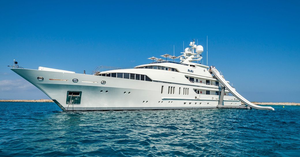 Charter yacht ROMA at anchor with water slide