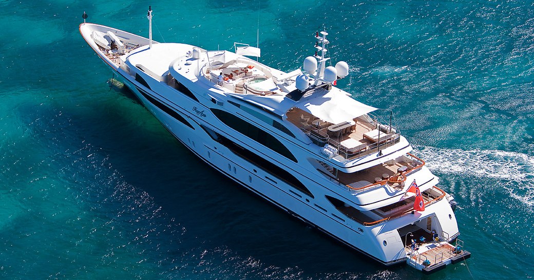 motor yacht JAGUAR at anchor on a Caribbean yacht charter with beach club open