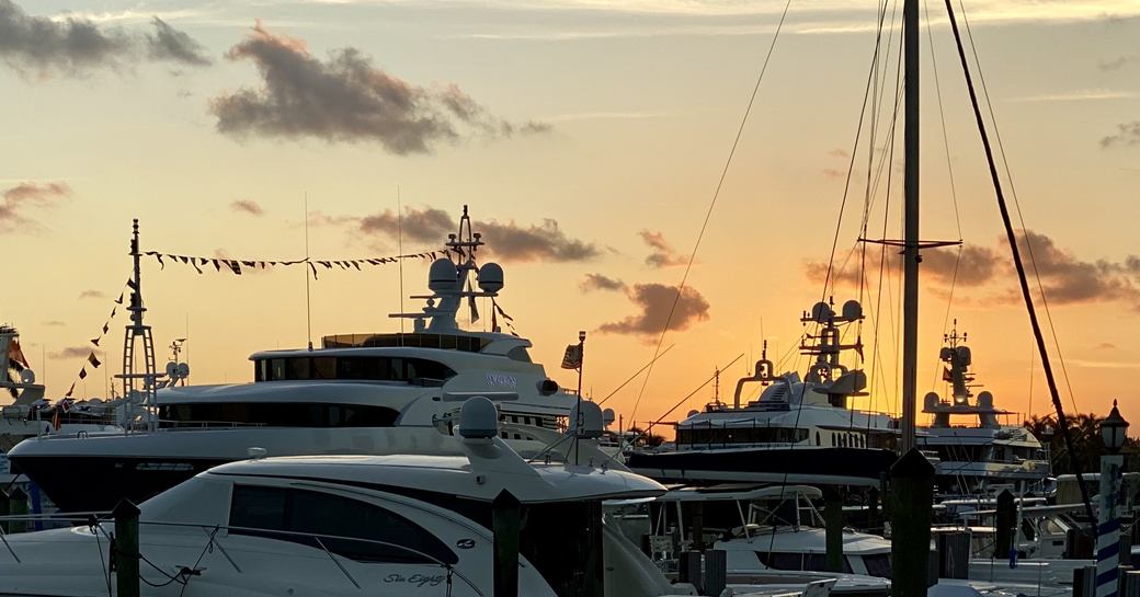 Yachts at FLIBS at sunset