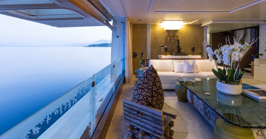 seating area with brilliant views in main salon aboard luxury yacht Coral Ocean