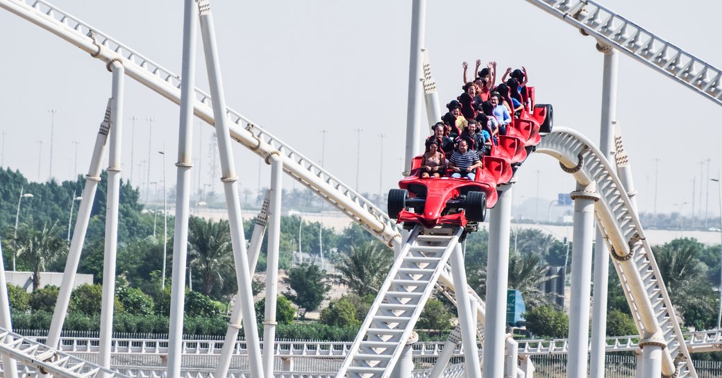 visitors on a roller coaster at Ferrari World Abu Dhabi 