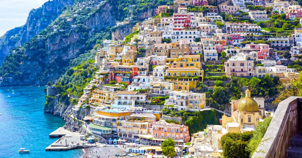 The town of Positano on the Amalfi Coast, with views over rugged mountains and blue sea 