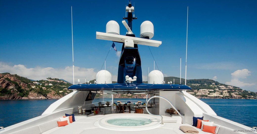 jacuzzi surrounded by sunpads on the sundeck of superyacht Cloud 9