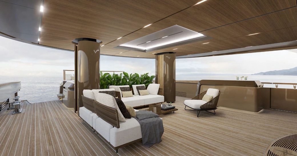 Exterior seating area onboard superyacht charter RAJA with L-shaped seating, an armchair and a small coffee table