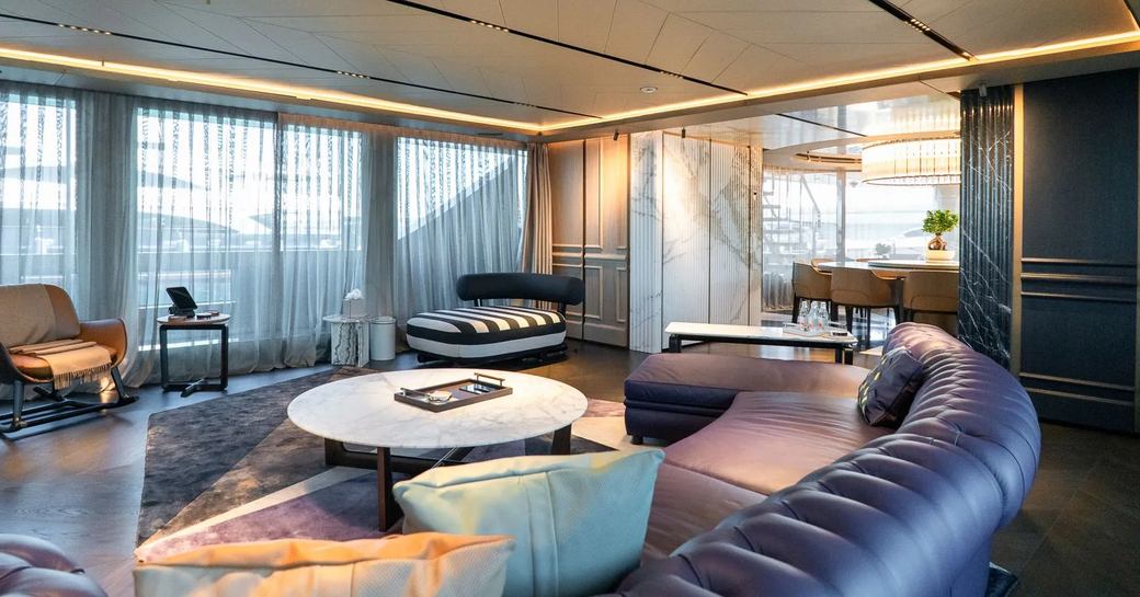 Charter yacht RAJA² main salon with purple seats