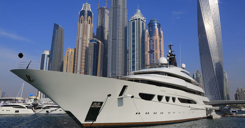 Superyacht berthed in Dubai Harbour, with the skyline visible in the background