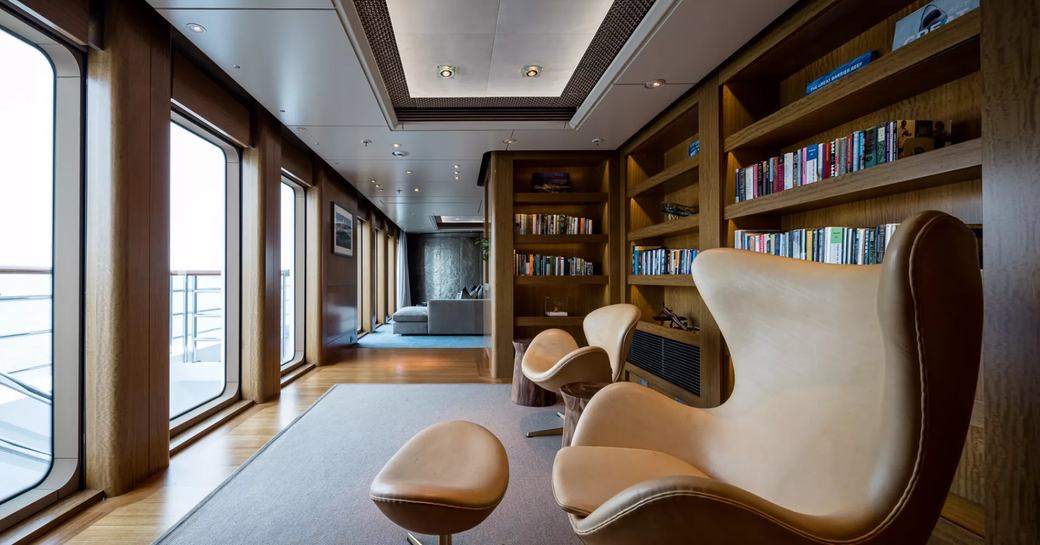 Library and armchairs onboard superyacht charter OCTOPUS