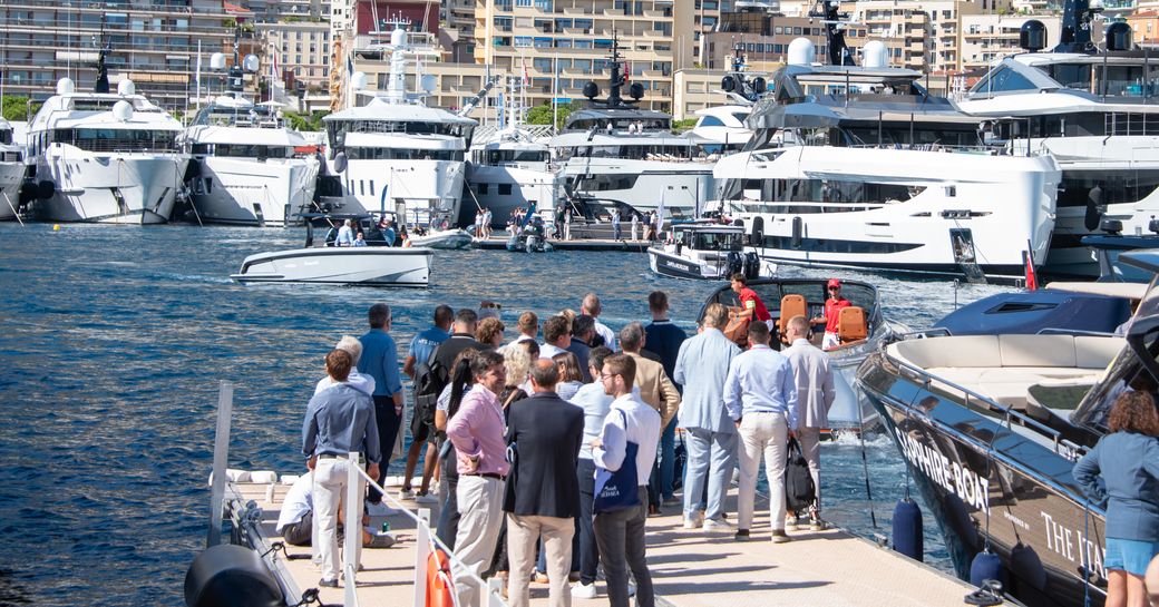 Visitors at Port Hercule looking at yachts
