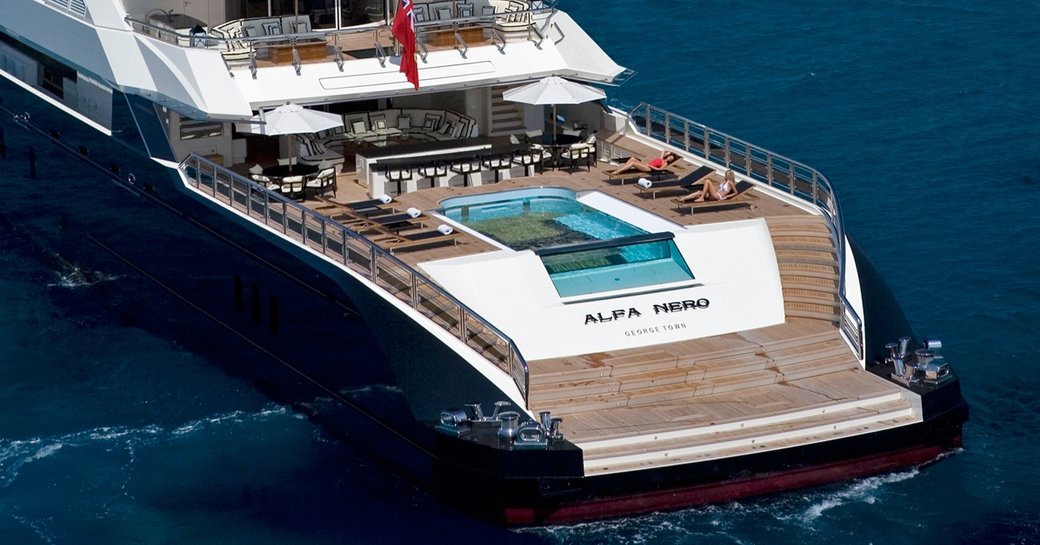 pool, bar, sun loungers and seating on the huge aft deck of superyacht ‘Alfa Nero’ 