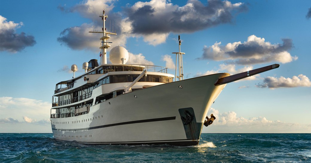 charter yacht chakra cuts through the water on a luxury yacht charter