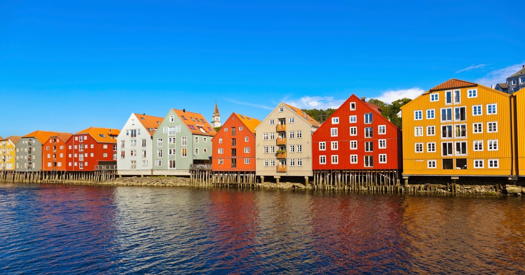 colourful houses along the water's edge in Trondheim Norway