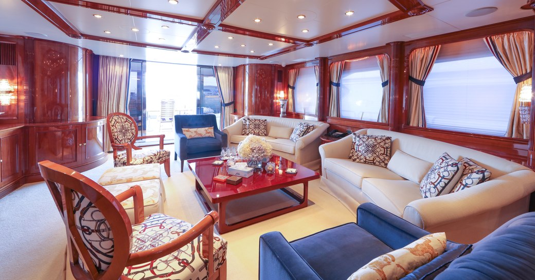 sofas and armchairs in the classically styled main salon aboard luxury yacht DXB 