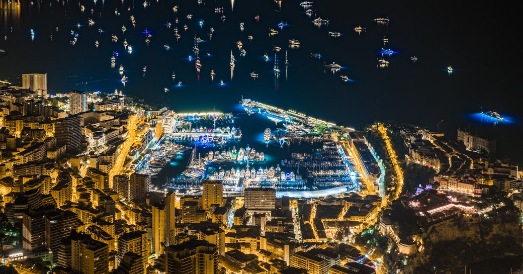 Port Hercule aerial view at night. Marina and yacht all lit up.