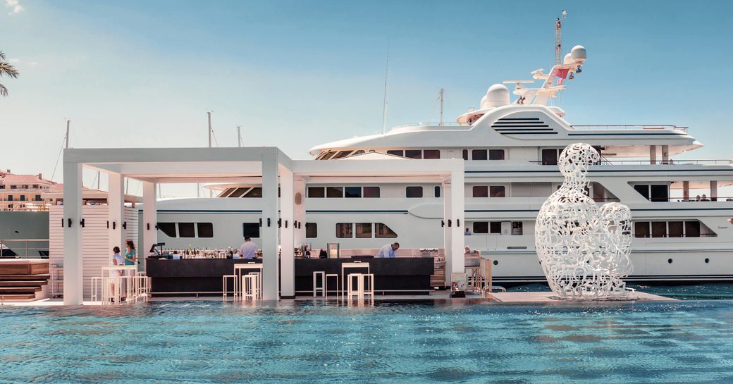 superyacht berths alongside famous swimming pool at Porto Montenegro