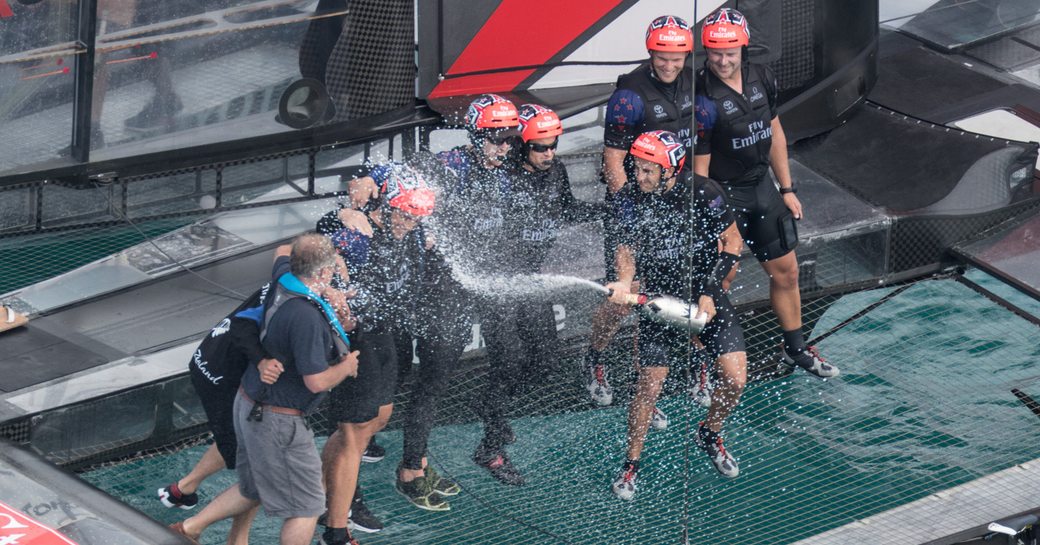 Emirates Team New Zealand celebrate on catamaran after winning the 2017 America’s Cup Challenger Playoffs