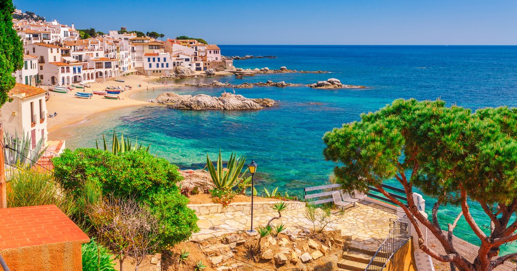 Sea landscape with Calella de Palafrugell, Catalonia, Spain near of Barcelona. Scenic fisherman village with nice sand beach and clear blue water in nice bay. Famous tourist destination in Costa Brava