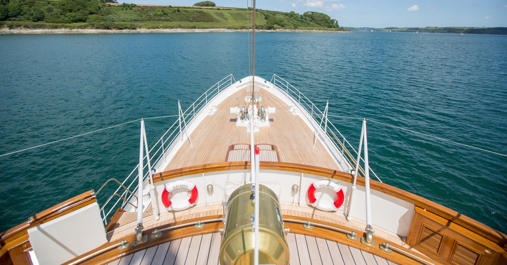 The bow of a superyacht looking out on the ocean