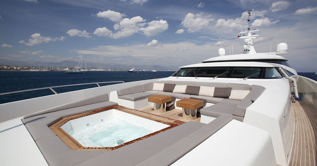 Foredeck of superyacht GEMS II, with Jacuzzi and open plan seating around it