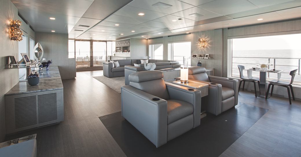 cool and contemporary main salon with huge windows on board superyacht ‘H