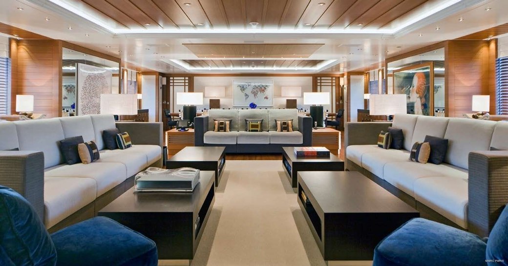 three large sofas in the contemporary main salon aboard superyacht Mary-Jean II 