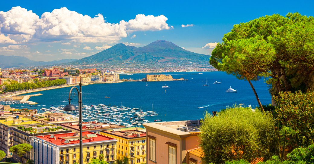 iew of the Gulf of Naples from the Posillipo hill with Mount Vesuvius far in the background.