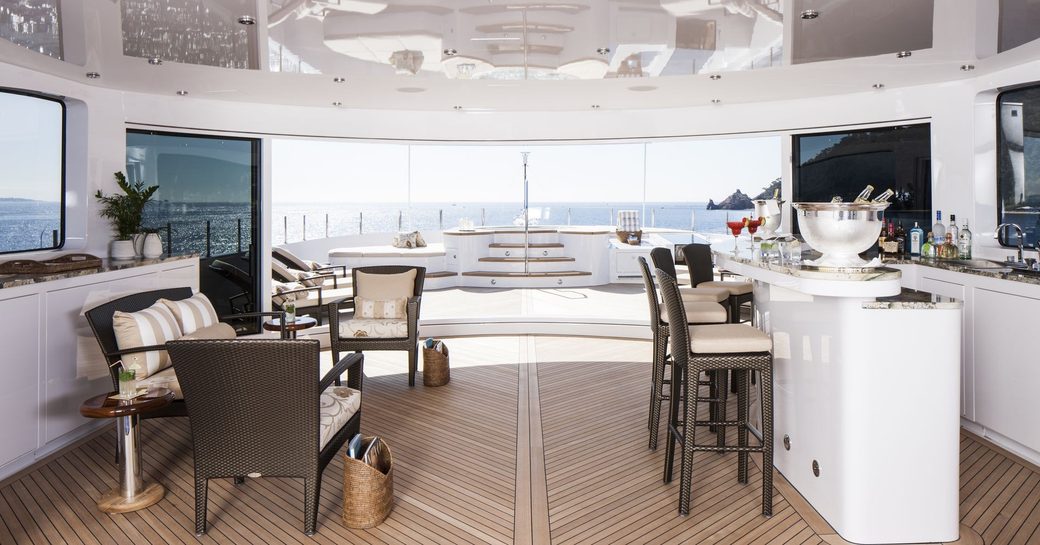 bar and seating area on the sundeck of luxury yacht LIBERTY