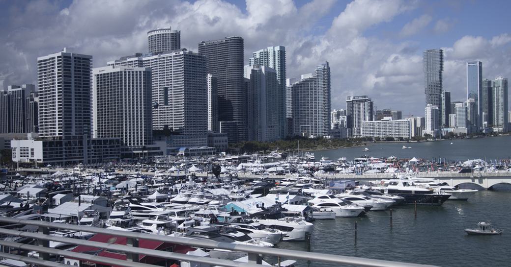 Overview of the Miami International Boat Show, with many motor yachts berthed