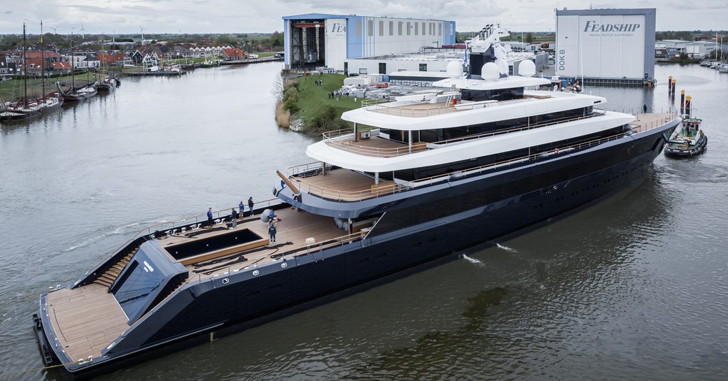 Aft angle view of Feadship Project 1012 outside Feadship construction facility