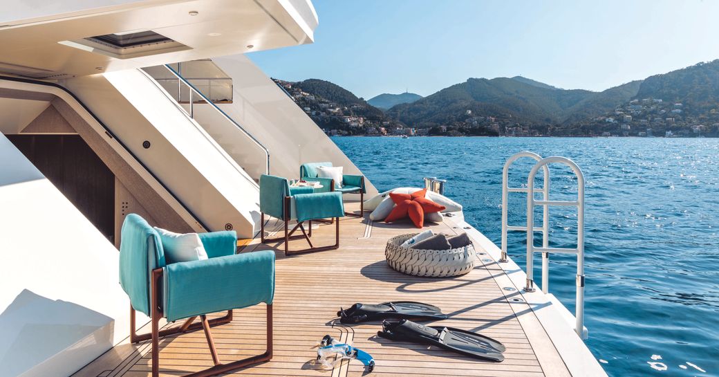 Overview of the swim platform and chairs, with snorkeling equipment by waterside