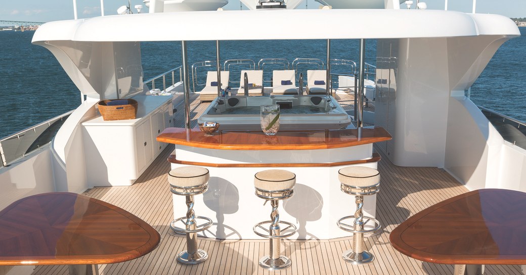 bar, Jacuzzi and sun loungers on the sundeck of luxury yacht Far From It 