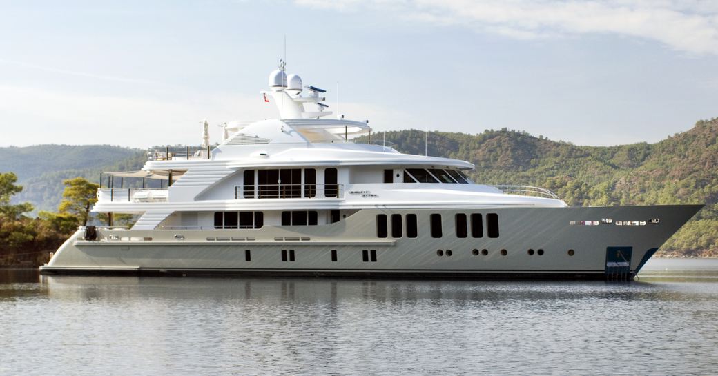 Yacht rental ORIENT STAR at anchor, surrounded by elevated terrain