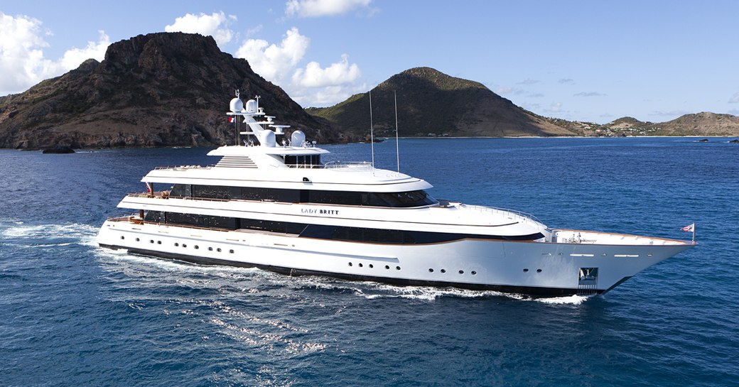 Charter Yacht 'Lady Britt' underway, surrounded by sea and rock formations in background