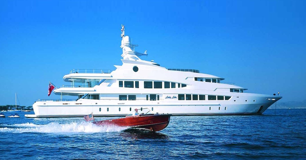 superyacht Lucky Lady cruises alongside tender