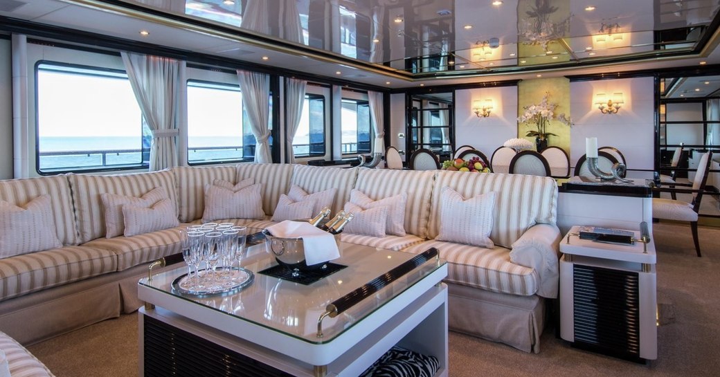 classically styled main salon with comfortable sofa aboard superyacht DIANE 