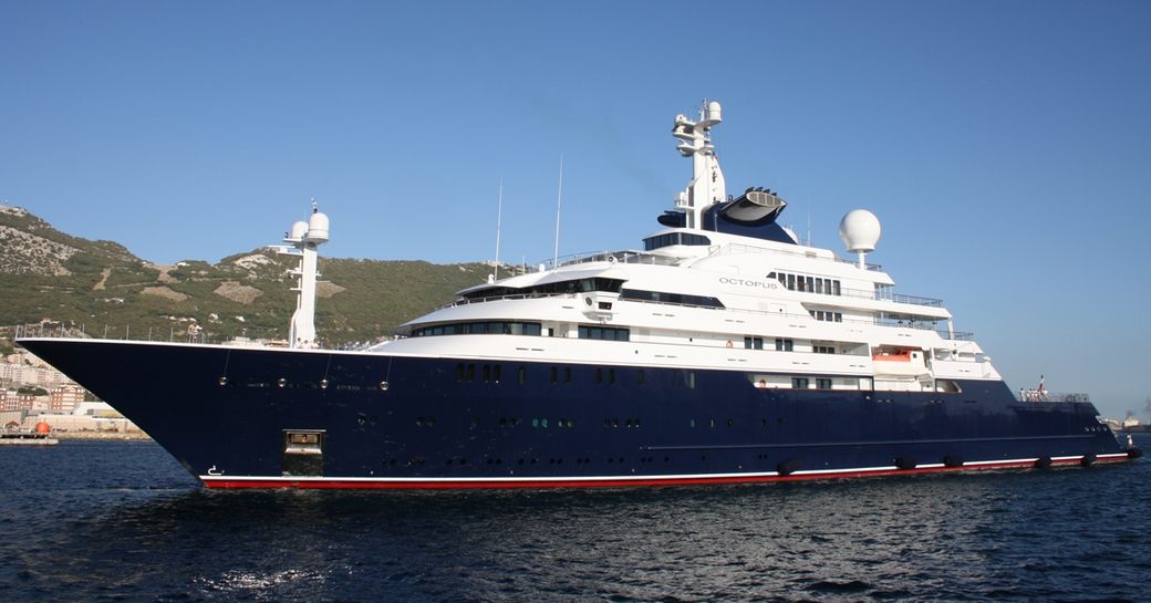 Superyacht charter OCTOPUS at sea with cliffs in the background