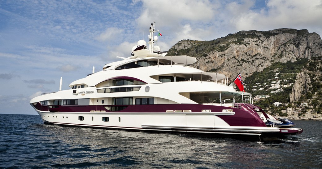 motor yacht QUITE ESSENTIAL anchored on a private yacht charter