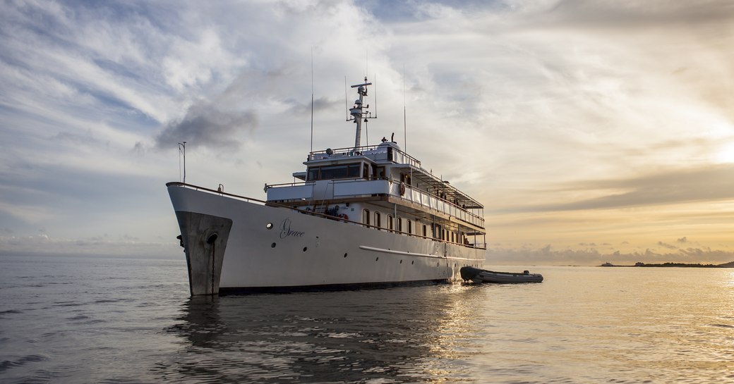 private charter yacht GRACE anchors at sunset