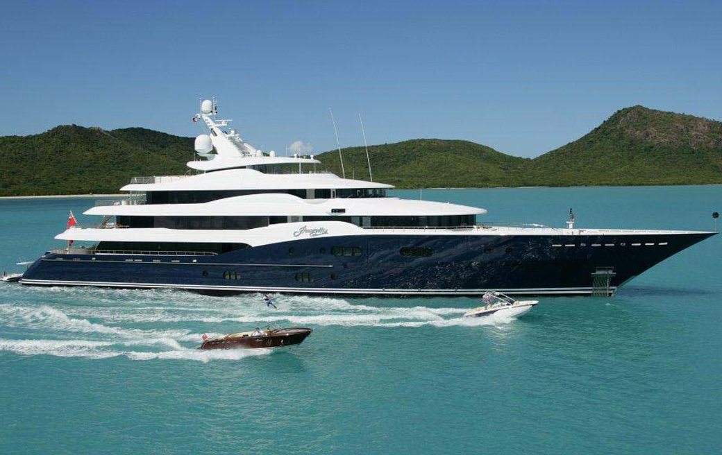 Charter yacht AMARYLLIS at sea, with water toys running alongside