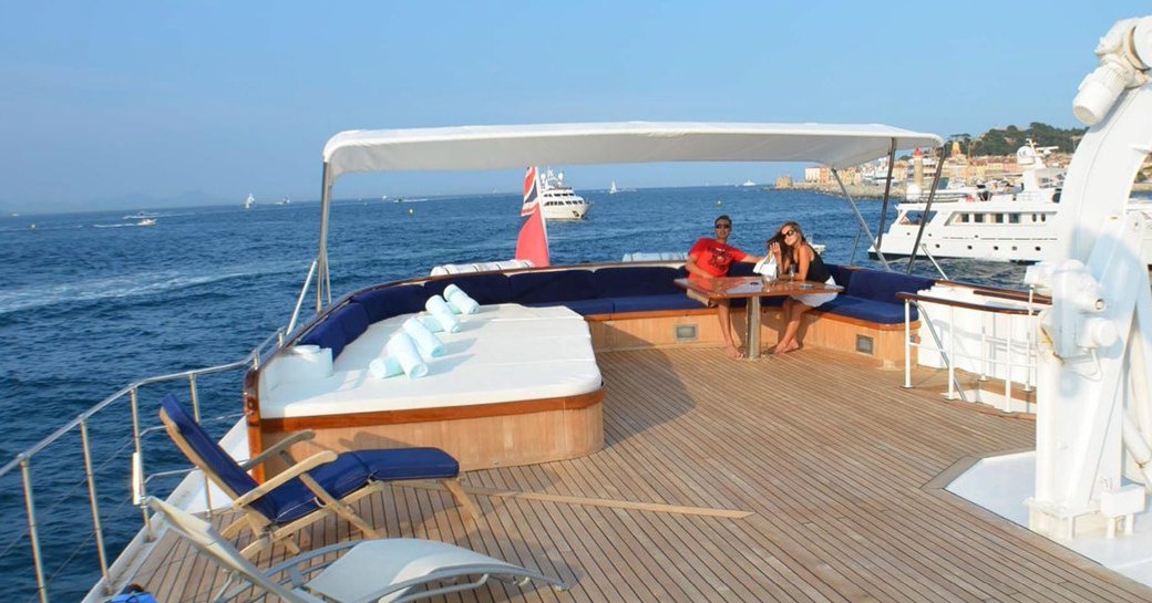 guests sit back and relax on the sundeck aboard classic yacht Secret Life 