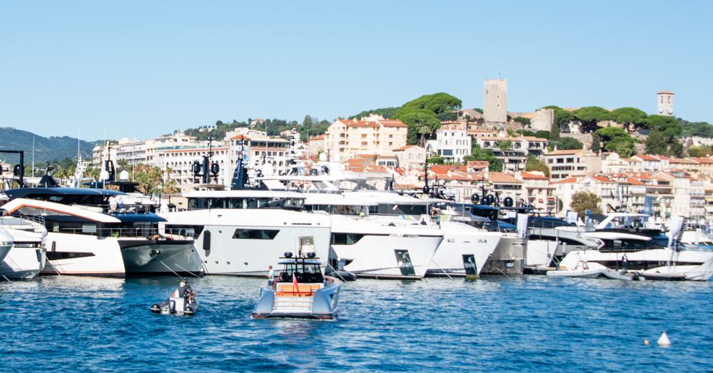 Water-level view of Vieux Port, Cannes, with motor yacht charters berthed