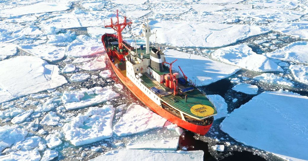Charter yacht ARGUS cruising through icy waters